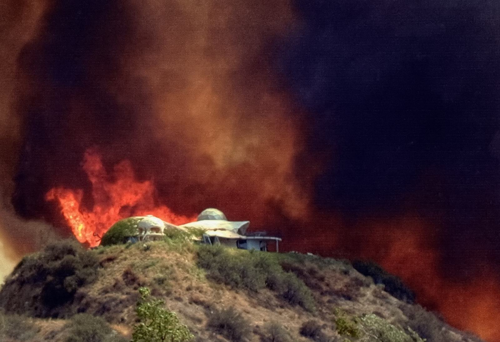 This Monolithic Dome house in California had a wildfire run right over the top of it.