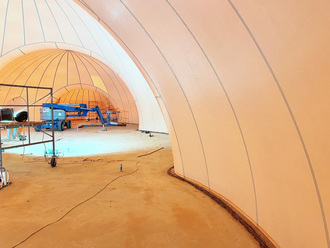 The double curved arches of the interior of a multi-dome inflated Airform in Aubrey, Texas. 