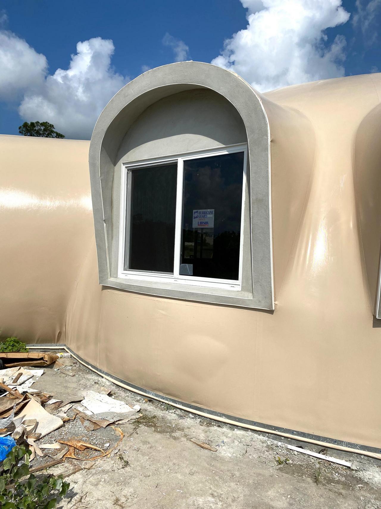 A window installed in an augment of the just finished Monolithic Dome shell for Maggie Chu's new home. 